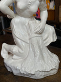 Close-up of porcelain sheaf and skirt detail on Soviet Gorodnitsa figurine 1950s-60s