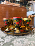 Set of six Russian Khokhloma wooden egg cups matching hand-painted tray in red, gold and black