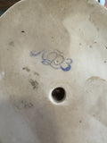 Underside of the figurine showing a blue factory stamp for Lomonosov Porcelain Factory and moulded number.