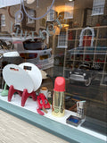 Piper-Heidsieck lipstick-shaped champagne cooler in shop window display