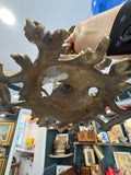Underside of antique Rococo style brass candelabra base, showing casting detail.
