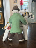 Back view of Kargopol clay toy of man with horse