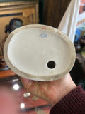Underside of the Lomonosov figurine showing the factory mark in blue Cyrillic script and other hand-painted numbers, identifying it as mid-20th century Soviet porcelain.