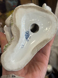 Underside of the figurine showing a blue Lomonosov Porcelain Factory mark and model number, hand-painted in Cyrillic.