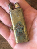 1932 brass Soviet lighter shown in hand for scale