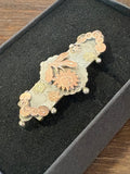 Victorian silver brooch with gold floral detail, hallmarked Birmingham 1886