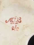 Underside of the base with the red Lomonosov factory mark (ЛФЗ) and handwritten decorator’s number.