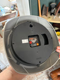 Back of Karlsson wall clock showing battery compartment and hanging mount