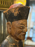 Profile of elderly face and Qing hat on antique Chinese wood official figure