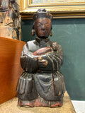 Antique Chinese carved wood Guanyin figure cradling a child, front view