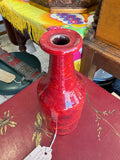 Top view of red glazed studio pottery vase showing open neck