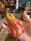 Hand holding JBP Products tinplate racing car number 5 showing side lithography and Made in England marking