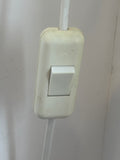 Close-up of white inline rocker on-off switch on white cable of Habitat Joséphine table lamp