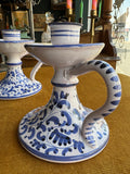 Close-up of Italian ceramic chamberstick candle holder showing handle and foliate design
