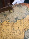 Arctic detail of a Philip's globe showing Siberia, the New Siberian Islands and Nicholas II Land beneath the brass finial