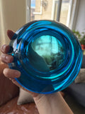 Interior of Union Sklo blue glass bowl held in hand