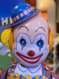 Wind up tin clown drummer