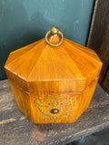 Octagonal lidded toleware box, painted with floral design