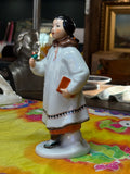 Side view of hand-painted Yakut Girl porcelain figurine, Made in Russia