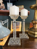 Pair of late Victorian pressed glass candlesticks with square bases