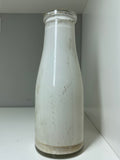 Old shop display milk bottle