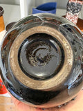 Underside of vase base showing unglazed foot ring, no maker's mark present