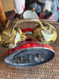 Overhead view of alarm clock showing brass bells and rear controls