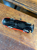 Underside of Schuco Patent Reversible Sedan showing clockwork mechanism
