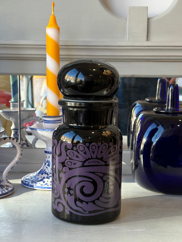 1960s Belgian black glass apothecary jar with purple psychedelic design and bubble-top lid