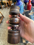 Candle holder held in hand showing full turned stem and cup