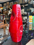 Mid-century red drip glaze pottery vase, front view in shop