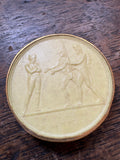 Full view of wax medallion with Napoleon figure, soldiers and inscription