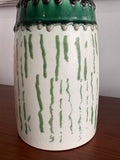 Close-up of raised lava glaze detailing on vintage Austrian ceramic vase