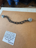 Hanging chain and artist's label on back of Anne Plant ceramic panel. 
