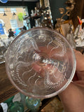 Top view into Georgian cordial glass showing engraved fern pattern radiating from base
