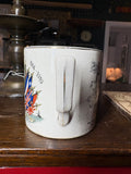 Handle view of WWI peace mug with crazing and wear