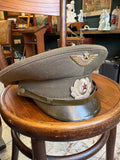 Side view of a Soviet Air Force officer's peaked cap with olive peak, chinstrap and star button