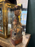 Three-quarter view of antique Chinese carved wood seated official figure