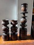 Close-up of two smaller holders and the taller centrepiece together