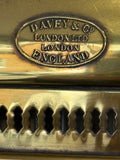Close-up of oval maker's plate reading Davey & Co London Ltd, London, England, above pierced vent band