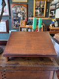 Vintage oak lectern shown from above, sloped reading surface and wooden feet