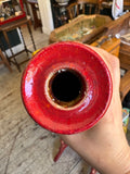 Close-up of red vase opening and interior glaze finish