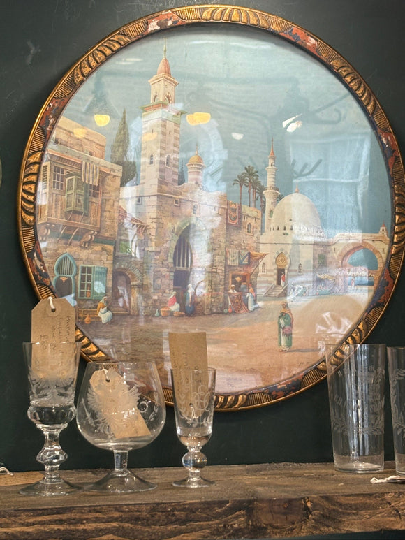 1920s framed lithograph of Arabic street scene by James Greig in decorative circular wooden frame. 