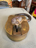 Top-down view of Dinesh padlock keyhole with key inserted