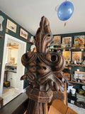 Close-up of the carved foliate scroll finial on an antique Gothic Revival oak lectern