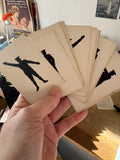 Fan of semaphore flash cards held in hand