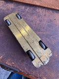 Underside of JBP 501 tinplate racing car showing pressed steel base and four wheels