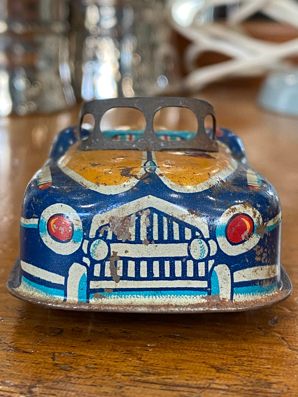 Vintage tin friction toy car