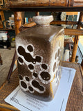 Side view of Strehla Keramik vase on antique shop shelf