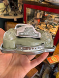 Close-up of front of Lucky Sports Car toy showing grille and headlights